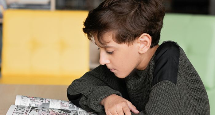 child-reading-comics-graphic-novels.jpg.optimal.jpg