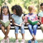 image-of-kids-reading-books-on-a-park-bench.jpg.optimal.jpg